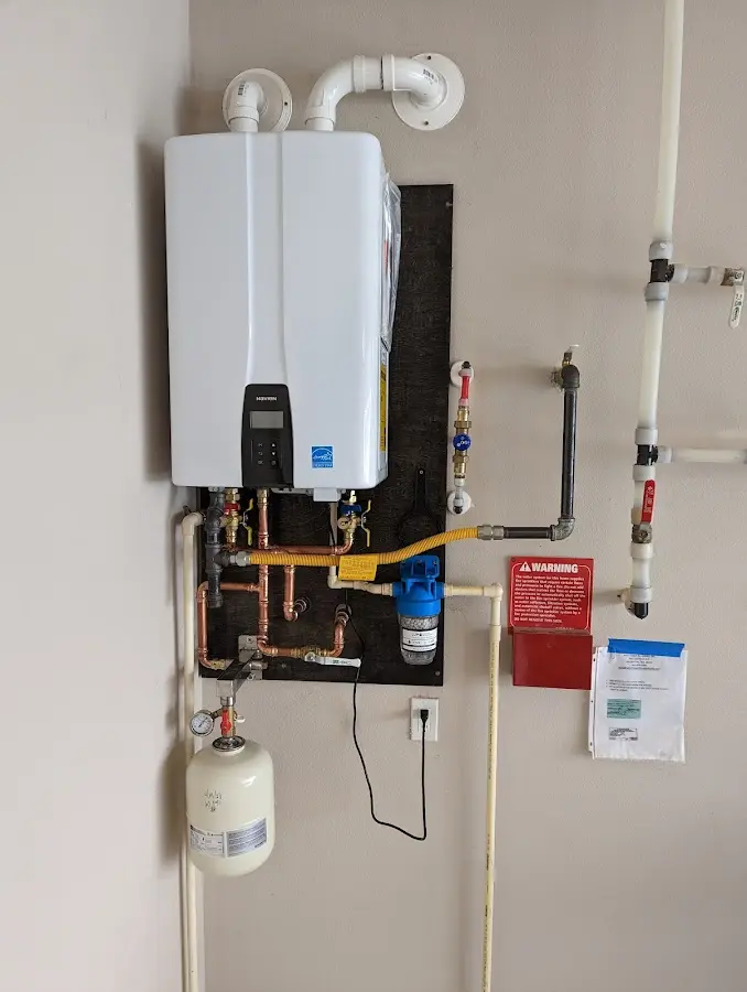 Professional plumber installing copper piping in a Gatlinburg home